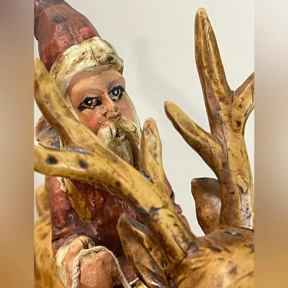 Primitive Folk Art Santa riding Reindeer 12”‎ tall chiseled resin faux wood